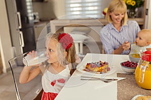 Mother having breakfast with her children