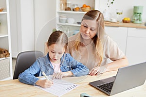 Mother Helping Daughter with Homework