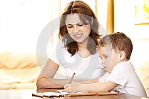 Mother helping in homework to her son