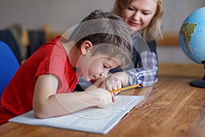 Mother helps son learning at home