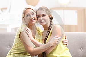 Mother and her adult daughter spending time at home