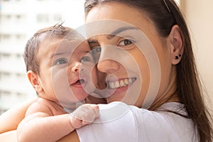 Mother with her baby on the lap