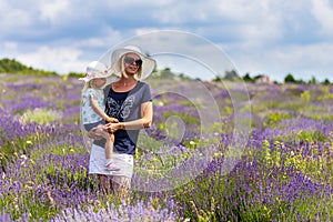 Mother with her baby in the lavender field