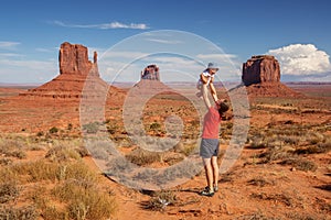 Mother with her baby son visit Oljato Monument Valley in Utah, U photo