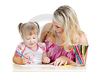 Mother and her child draw with colour pencils