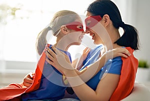 Girl and mom in Superhero costume