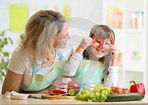 Mother and her child preparing healthy food and