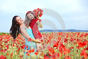 Mother with her child in spring field