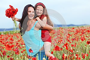 Mother with her child in spring field