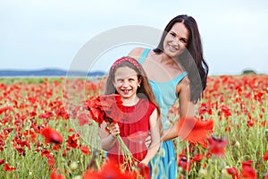 Mother with her child in spring field
