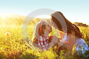 Mother with her child in spring field