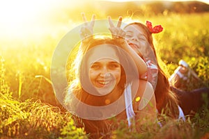 Mother with her child in spring field