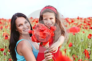 Mother with her child in spring field