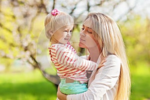 Mother and her child in spring park