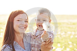 Mother with her child in sunlight