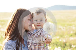 Mother with her child in sunlight