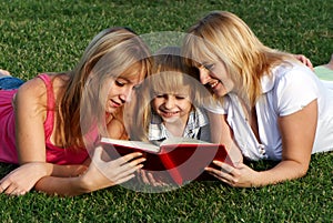 Mother with her children on the meadow