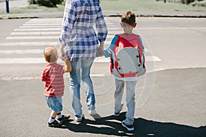 Mother and her children about to cross road