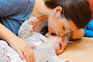 Mother with her crying baby