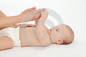 Mother and her cute child on white. Baby massage and exercises