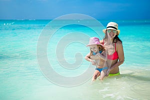 Mother with her cute daughter have fun on summer