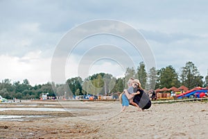 Mother and her cute little son enjoying time at beach