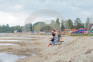 Mother and her cute little son enjoying time at beach