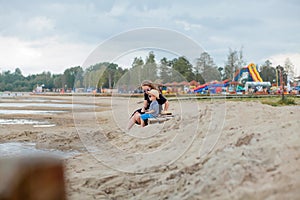 Mother and her cute little son enjoying time at beach