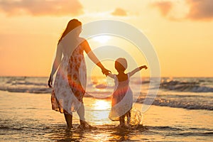 Mother with her daughter on the beach