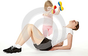 Mother and her daughter doing sport exercises
