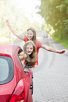 Mother With Her Daughter Going For A Ride In Car