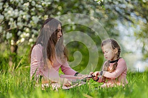 mom and daughter looking at a tablet