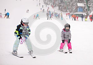 Mother and her daughter skiing