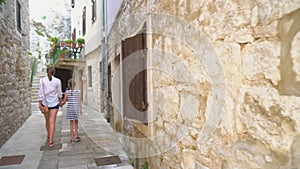 Mother with her daughter walking.