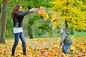 Mother and her little child having fun in a park