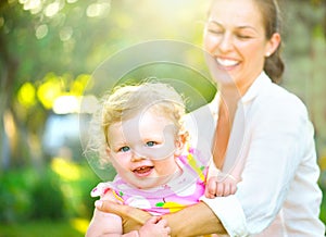 Mother with her little daughter outdoors