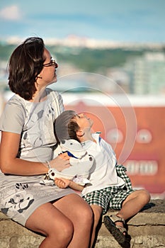 Mother and her little son outdoors in city