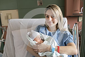 Mother with her newborn baby at the hospital a day after a natural birth labor