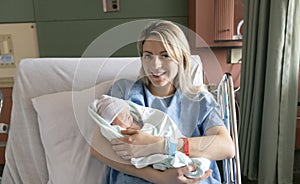 Mother with her newborn baby at the hospital a day after a natural birth labor