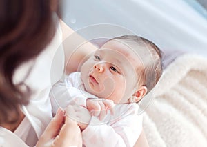 Mother with her newborn baby. Mother is holding her little baby