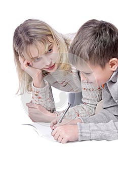 Mother with her son drawing in copy-book