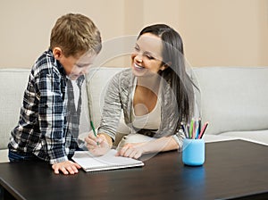 Mother with her son drawing