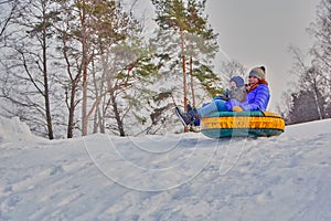 Mother and her son enjoying sleigh ride