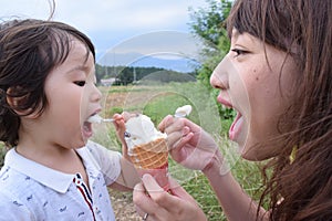 mother and her son are palying outer place photo