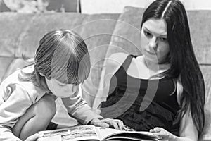 Mother and her son read book