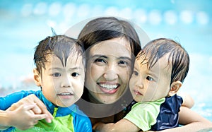 Mother And her sons In The Swimming Pool