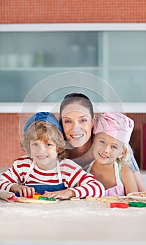 Mother with her Two Kids in the kitchen