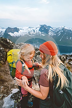 Mother hiking with daughter in mountains outdoor together family vacations lifestyle travel adventure activity