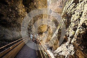 Mother hikking with four kids in Liechtensteinklamm or Liechtenstein Gorge, Austria