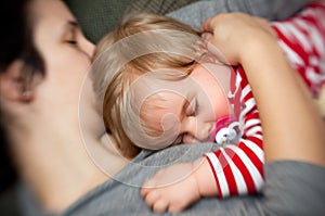 Mother hold sleeping baby